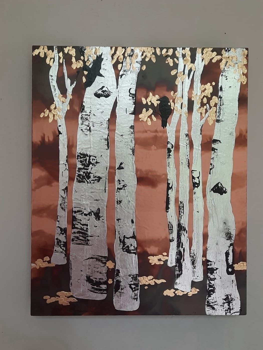 Raven painting with copper leafing on wood